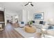 Open-concept living room with modern furnishings, hardwood floors, and plenty of natural light at 883 6Th S Ave, St Petersburg, FL 33701