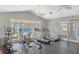 Community gym with treadmills, exercise bike, weights, and plenty of natural light at 9481 Highland Oak Dr # 313, Tampa, FL 33647