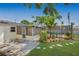 Backyard with a screened in porch and pool enclosure at 226 75Th N St, St Petersburg, FL 33710