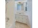 Cozy bathroom featuring a shower, vanity, and tiled walls and floors at 226 75Th N St, St Petersburg, FL 33710