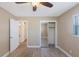 Cozy bedroom with wood-look floors, neutral walls, closet and exterior access at 226 75Th N St, St Petersburg, FL 33710