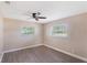 Comfortable bedroom featuring neutral walls, wood-look floors, and a ceiling fan at 226 75Th N St, St Petersburg, FL 33710