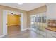 Bright kitchen area with sliding doors to the lanai and an open doorway leading to an adjacent room with yellow walls at 226 75Th N St, St Petersburg, FL 33710