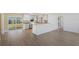 Bright, airy living room open to kitchen and featuring wood-look flooring at 226 75Th N St, St Petersburg, FL 33710