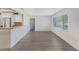Living area with light-colored flooring and walls, a large window, and an open layout at 226 75Th N St, St Petersburg, FL 33710