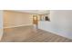 Spacious living room featuring wood-look floors, neutral paint, and an open layout at 226 75Th N St, St Petersburg, FL 33710
