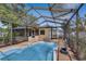 A screened-in pool with a patio offers outdoor enjoyment with privacy at 226 75Th N St, St Petersburg, FL 33710