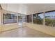 Screened sunroom offers views of the yard and pool at 226 75Th N St, St Petersburg, FL 33710