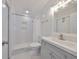Clean bathroom featuring white subway tiles, a modern vanity, and a glass-enclosed shower at 1011 Spindle Palm Way, Apollo Beach, FL 33572
