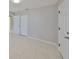 Bedroom with tile flooring and bi-fold closet doors at 1011 Spindle Palm Way, Apollo Beach, FL 33572
