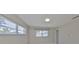 Bright, spacious bedroom featuring fresh paint, tile flooring, and plenty of natural light at 1011 Spindle Palm Way, Apollo Beach, FL 33572