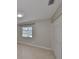 Bedroom with tile flooring, a window with a view, and a closet at 1011 Spindle Palm Way, Apollo Beach, FL 33572