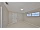 Bedroom with tile flooring, window, and a door at 1011 Spindle Palm Way, Apollo Beach, FL 33572