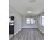 The dining room has modern floors with lots of natural light at 1011 Spindle Palm Way, Apollo Beach, FL 33572