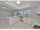 Spacious kitchen with ample countertop space, stainless steel appliances, and a view of the water at 1011 Spindle Palm Way, Apollo Beach, FL 33572
