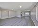 Bright and airy living room featuring modern gray flooring and neutral paint at 1011 Spindle Palm Way, Apollo Beach, FL 33572
