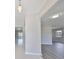 Open-concept space with tile and wood flooring, abundant natural light and a view of the outdoors at 1011 Spindle Palm Way, Apollo Beach, FL 33572