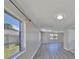 Open floor plan featuring new gray flooring and plenty of windows at 1011 Spindle Palm Way, Apollo Beach, FL 33572