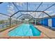 A delightful screened in pool and waterfront area featuring lots of space for entertaining at 1011 Spindle Palm Way, Apollo Beach, FL 33572