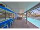 A delightful screened in pool and waterfront area featuring lots of space for entertaining at 1011 Spindle Palm Way, Apollo Beach, FL 33572