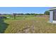 Expansive backyard with direct water access, offering serene views and outdoor enjoyment at 10540 Carloway Hills Dr, Wimauma, FL 33598