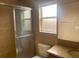 Bathroom featuring tiled shower and vanity at 10540 Carloway Hills Dr, Wimauma, FL 33598