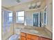 Bathroom featuring tile floors, shower, and a vanity at 10540 Carloway Hills Dr, Wimauma, FL 33598