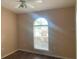 A bedroom bathed in light from an arched window at 10540 Carloway Hills Dr, Wimauma, FL 33598