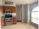 Kitchen featuring stainless steel appliances and lots of cabinet space at 10540 Carloway Hills Dr, Wimauma, FL 33598