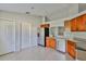 Modern kitchen features stainless steel appliances and granite countertops at 10540 Carloway Hills Dr, Wimauma, FL 33598