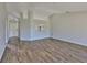 Spacious living room with wood floors and lots of natural light at 10540 Carloway Hills Dr, Wimauma, FL 33598