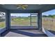Spacious screened-in porch with lake view at 10540 Carloway Hills Dr, Wimauma, FL 33598