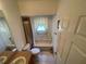 Bathroom featuring a bathtub with shower, toilet, vanity, and tiled floor at 11185 Heathrow Ave, Spring Hill, FL 34609