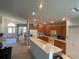 Open kitchen featuring a center island, bright countertops, and ample storage at 11185 Heathrow Ave, Spring Hill, FL 34609