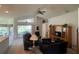 Relaxing living room with vaulted ceilings, sliding glass doors, and entertainment center at 11185 Heathrow Ave, Spring Hill, FL 34609