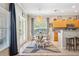 Charming dining area with a pendant light fixture and views of the kitchen and backyard at 11519 Cypress Reserve Dr, Tampa, FL 33626