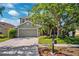 Charming two-story home featuring a well-manicured lawn and a two-car garage at 11519 Cypress Reserve Dr, Tampa, FL 33626