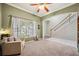 A comfortable living room featuring a large window and neutral tones at 11519 Cypress Reserve Dr, Tampa, FL 33626
