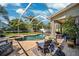 Inviting screened-in pool area with a spa, perfect for relaxation and entertainment at 11519 Cypress Reserve Dr, Tampa, FL 33626