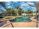 Sparkling pool and spa surrounded by a brick patio and lush landscaping at 11519 Cypress Reserve Dr, Tampa, FL 33626