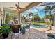 Relaxing screened-in pool area with comfortable seating and views of the lush backyard at 11519 Cypress Reserve Dr, Tampa, FL 33626