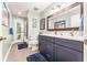 Bathroom features double sink vanity, walk-in shower, and outdoor access at 12408 Wexford Hills Rd, Riverview, FL 33569