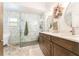 Bathroom features a double sink vanity, walk-in shower, and stylish fixtures at 12408 Wexford Hills Rd, Riverview, FL 33569