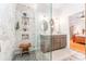 Walk-in shower features stylish tile, and dual shower heads at 12408 Wexford Hills Rd, Riverview, FL 33569
