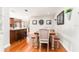 Cozy dining area featuring a stylish table and chairs, adjacent to an open kitchen for seamless entertaining at 12408 Wexford Hills Rd, Riverview, FL 33569
