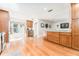 Bright kitchen featuring wood cabinets, stainless steel appliances, and hardwood floors at 12408 Wexford Hills Rd, Riverview, FL 33569