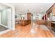 Open-concept kitchen with wood cabinets, stainless steel appliances, an island, and hardwood floors at 12408 Wexford Hills Rd, Riverview, FL 33569