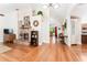 Bright and spacious living room with a brick fireplace, hardwood floors, and an open layout at 12408 Wexford Hills Rd, Riverview, FL 33569