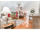 Open living room with hardwood floors, comfortable seating, and access to the kitchen at 12408 Wexford Hills Rd, Riverview, FL 33569