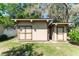 Durable storage shed with double doors and classic style that is set amongst a tranquil lawn at 12408 Wexford Hills Rd, Riverview, FL 33569